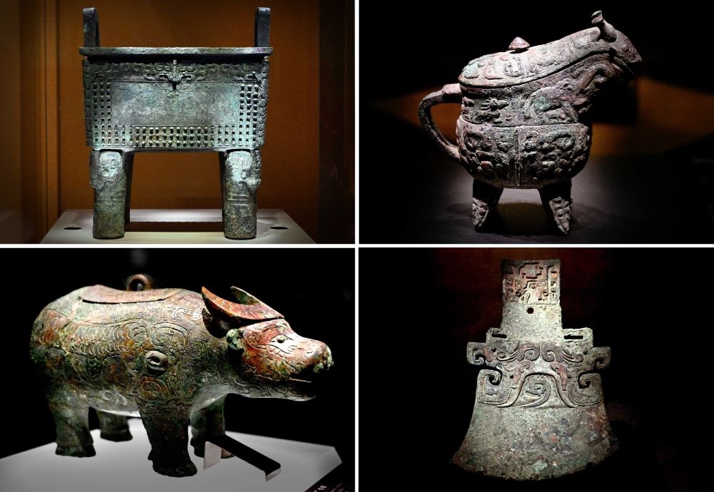 這是殷墟博物館新館內(nèi)展出的“司母辛”銅鼎（左上）、“亞長”銅?。ㄓ疑希ⅰ皝嗛L”牛尊（左下）、“亞長”銅鉞（拼版照片，2月23日攝）。